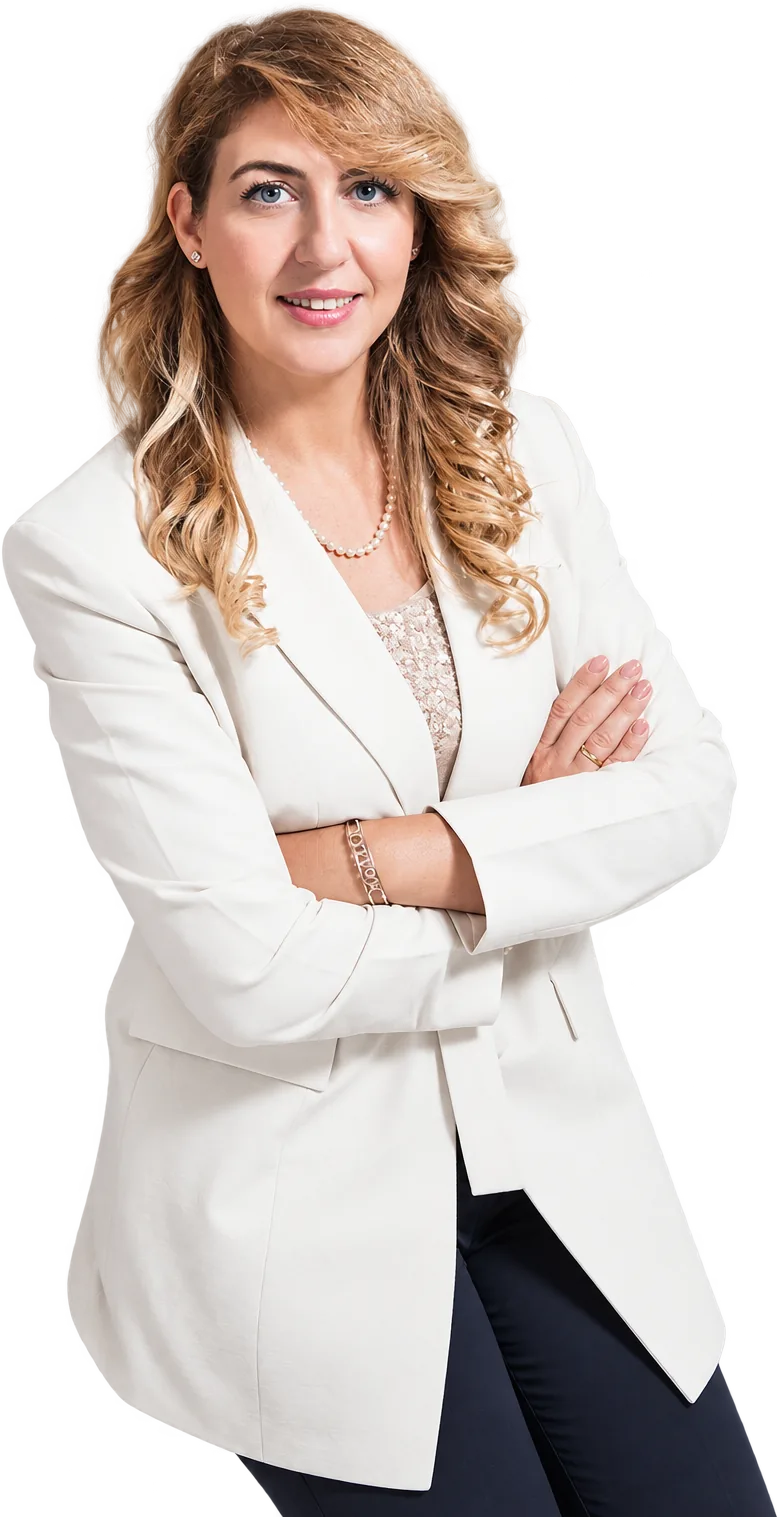 Dr. Monica Perna in a white blazer, arms crossed
