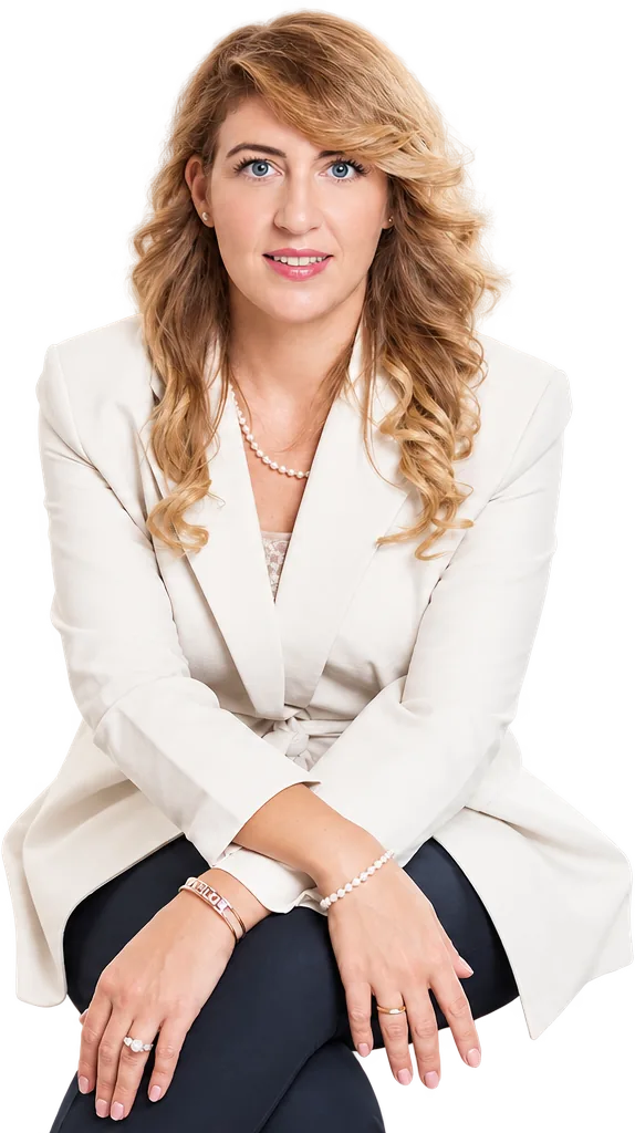 Dr. Monica Perna seated in a white blazer, smiling